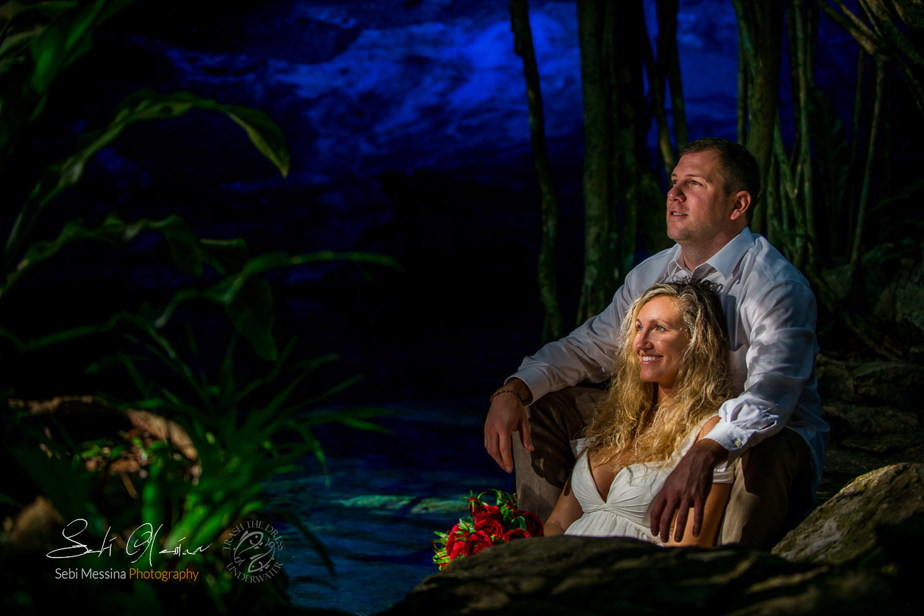 Perfect light on a bride and a groom posing during a cenote trash the dress..