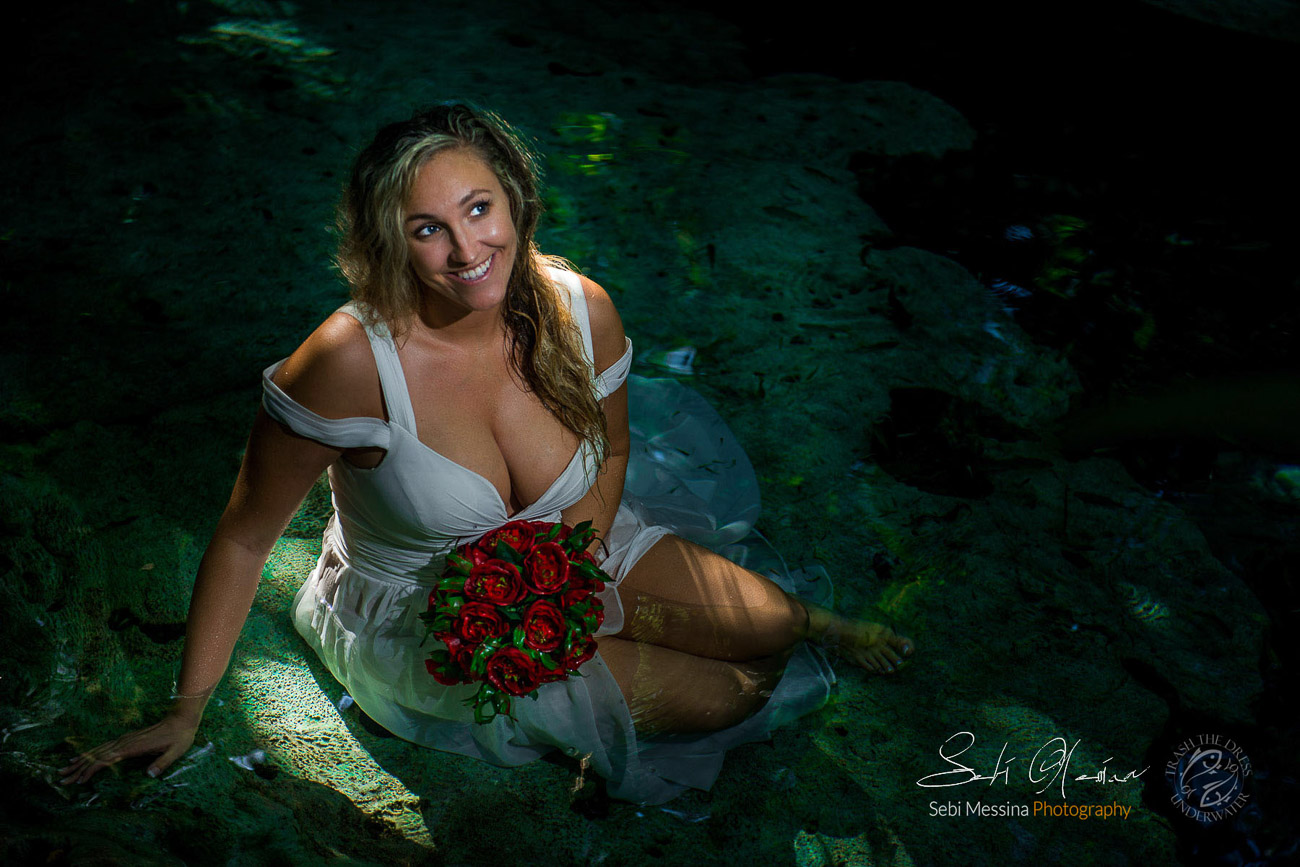 Stunning bride enjoying the Underwater Trash The Dress experience
